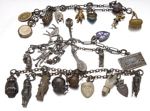 Twenty-six 19th and early 20th c. charms on chains