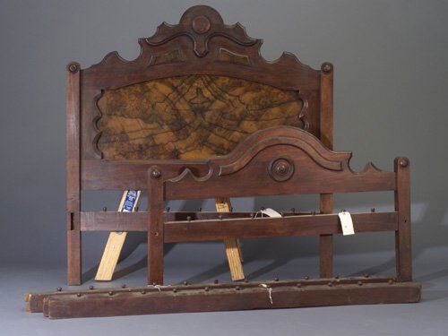Victorian walnut rope bed with burled woo: Victorian walnut rope bed with burled wood panel and tall turned posts, complete with notched side rails. 57" x 53 3/4"