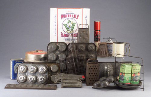 Vintage tin, metal, and ceramic kitchen: Vintage tin, metal, and ceramic kitchen equipment incl. ribbed muffin pans, graters, baster in original box, stove-top toaster, more than ten.