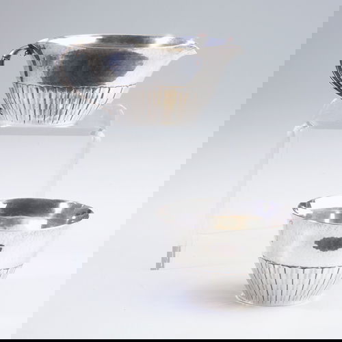 Johan Rohde for Georg Jensen creamer and sugar, wi: Johan Rohde for Georg Jensen creamer and sugar, with subtle hand-hammered surface and overlay decoration. (Rohde joined the firm on a full-time basis in 1913.) One marked. Creamer: 2 1/8" x 5" x 3" di