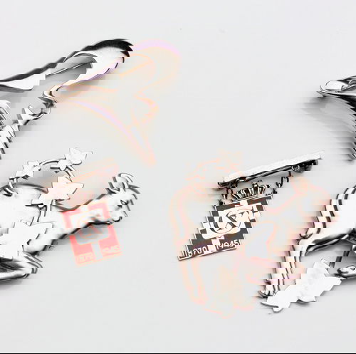 GEORG JENSEN/DENMARK Three sterling brooches: Henni: GEORG JENSEN/DENMARK Three sterling brooches: Henning Koppel amoebic form no. 324; Arno Malinowski fawn and ivy vine no. 311; King's Emblem brooch. Largest 2" x 2"