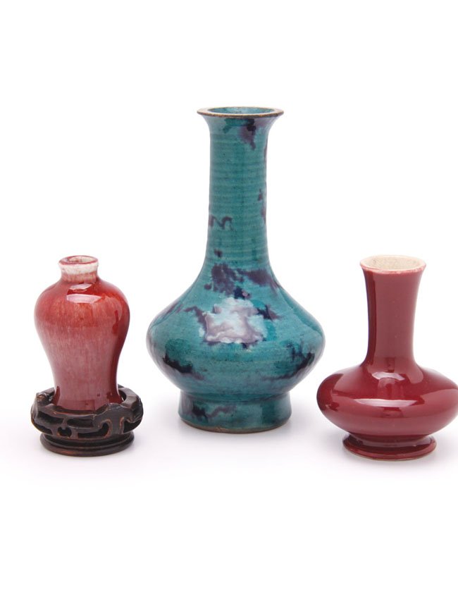 Three Chinese porcelain vases: One decorated with spotted blue design under turquoise glaze. One ox blood glaze vase and ox blood glaze snuff bottle. H. 14cm, 8cm and 7cm.
