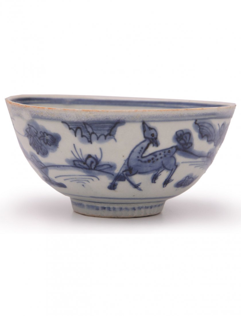 Chinese Ming Dynasty Underglaze blue Decorated Bowl: With a design of deer and birds in a landscape. The inside with a convex base, underglaze blue peach and double ring circles and the underside with an underglaze blue shop mark. Probably 16th century,
