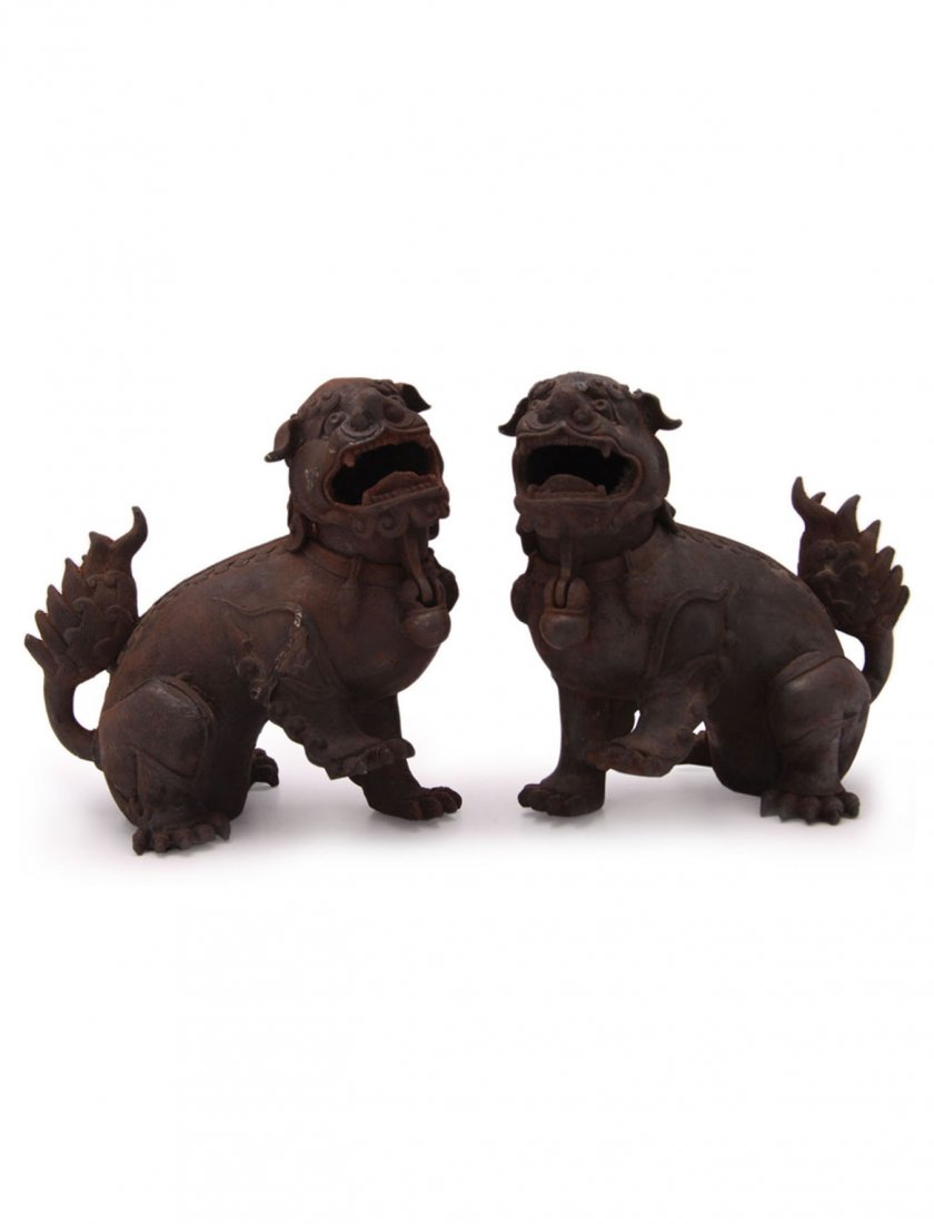 Rare Pair of Chinese Cast-iron Censers: In the form of Fu dogs. Their heads are hinged to enable the incense to be burned inside. Age unknown, possibly Ching or Republic period. H. 17cm.
