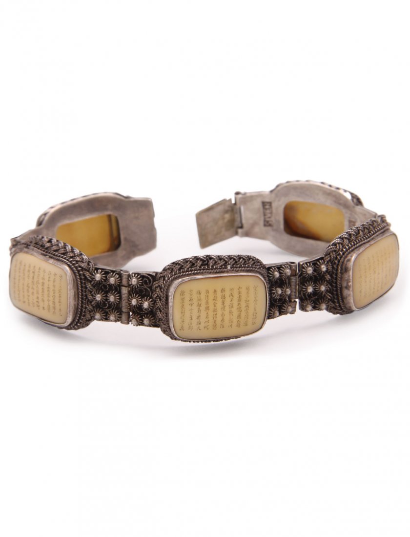 Chinese Silver Filigree Bracelet: Comprising five links each containing an ox bone panel bearing columns of miniature calligraphic writings. Approximately 70 characters per panel. Silver stamp to one. Note: We are uncertain of the mat