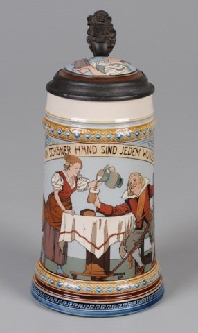 Mettlach Stein: .5L, 2640, etched, inlaid lid, Barmaid and drinker, signed Quidenus (1" hairline at top near handle) Provenance: Dennis Galloway Estate, Etowah, NC