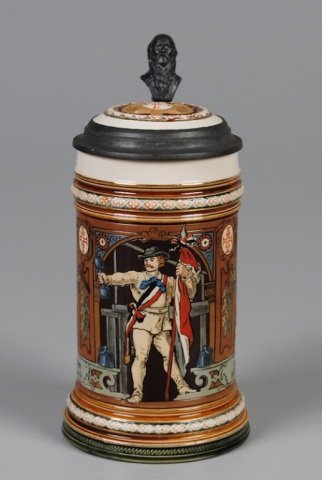 Mettlach Stein: .5L, 1914, etched, inlaid lid, 4F stein, athlete holding flag and dumbbell Provenance: Dennis Galloway Estate, Etowah, NC