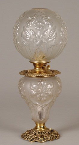 Gone-With-The-Wind Oil Lamp: frosted glass, iris pattern, wick stem mkd Success, openwork brass base, 27"h Provenance: Joe L. Worley Estate, Bethel, NC