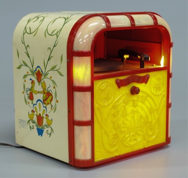 Bing Crosby Junior Jukebox, c.1948: by Ideal Novelty & Toy Co., yellow and marbleized plastic front (lighted), painted metal sides, appears to be in working condition