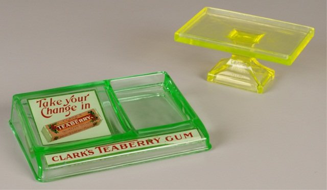 Two Clark's Teaberry Gum Displays: vaseline glass, display w/change tray, 6 x 9 x 1-3/4" (minor decal wear); footed display stand, 3-1/4 x 6-3/4 x 4-3/4" (top w/wear) Provenance: Joe L. Worley Estate, Bethel, NC