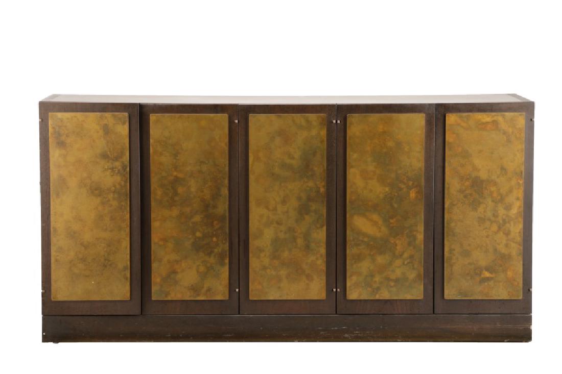 Harry Lunstead Stained Walnut & Brass Buffet: Harry Lunstead (American, Seattle, active 1970s-80s). A paneled stained walnut five-door buffet or sideboard, having a rectangular form topped with a patinated brass panel, over two pairs of cabinet d