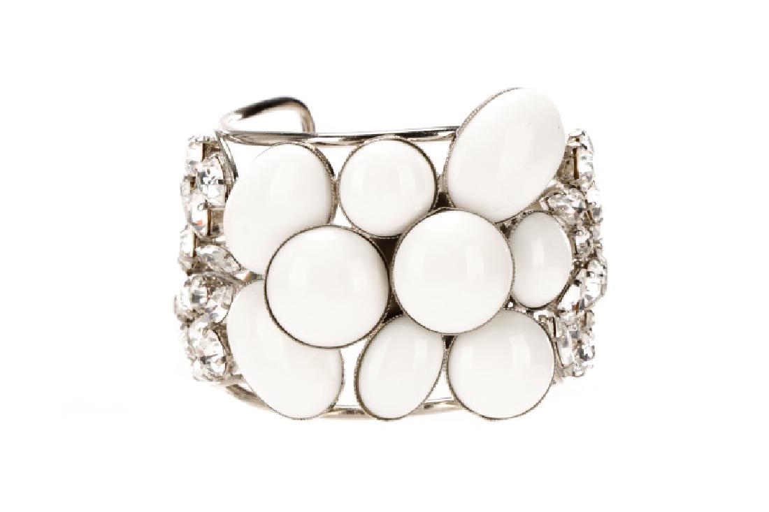 Philippe Ferrandis Cuff Bracelet: Philippe Ferrandis (French, founded 1986). A silvertone cuff bracelet, set with opaque white glass cabochons and clear stones, likely Swavorski crystals. Marked to interior. Approximate interior lengt