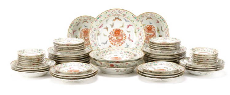 Famille Rose Partial Dinner Service, Guangxu Marks: Chinese, Guangxu period marks (1875-1908). Fifty nine (59) piece Chinese Export famille rose partial dinner service decorated with butterflies centering a iron red dragon chasing the flaming pearl com