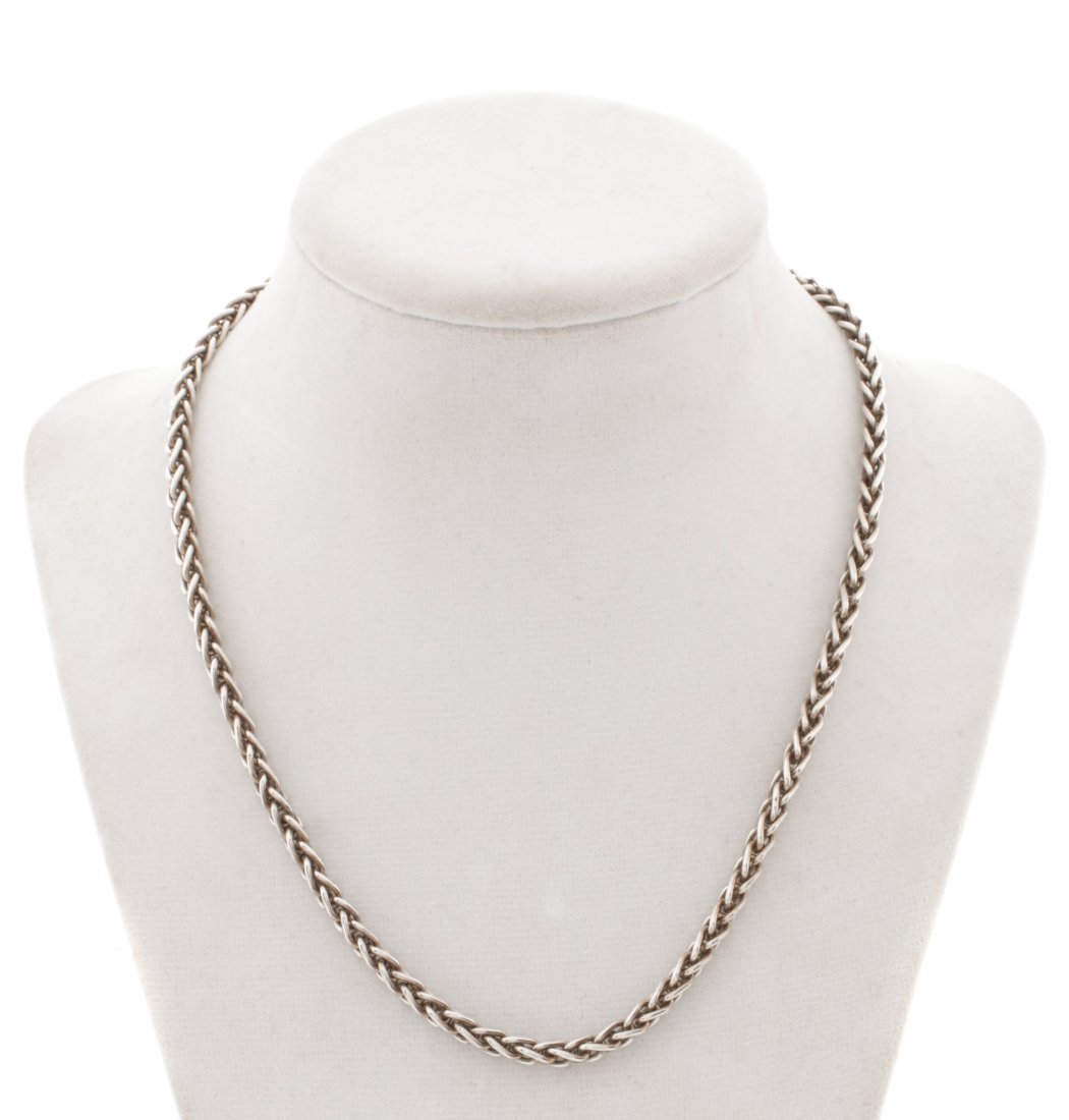 John Hardy Sterling & 18k Gold Chain Necklace: John Hardy (Balinese, founded 1975). A sterling silver and 18k yellow gold chain necklace. Marked with maker's trademark JH, marked as 925 and 18k quality. Length 7.475". Total weight 36.2 grams.