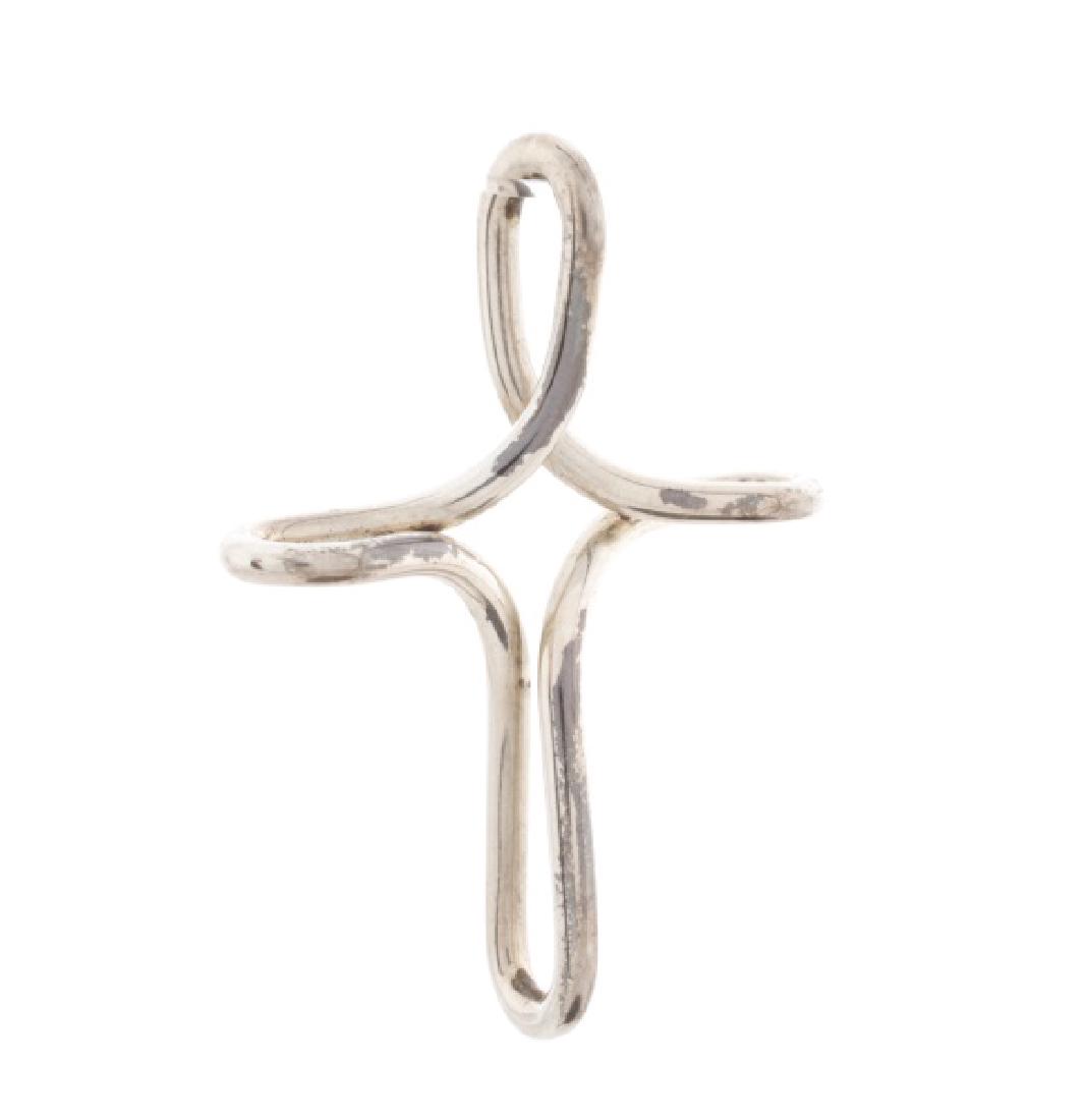 Peretti for Tiffany & Co. Cross Necklace Pendant: Elsa Peretti for Tiffany & Co. (American, founded 1837). An open cross pendant in sterling silver. Includes signature blue pouch. Marked with maker's trademarks Tiffany & Co. and Peretti, marked as 92