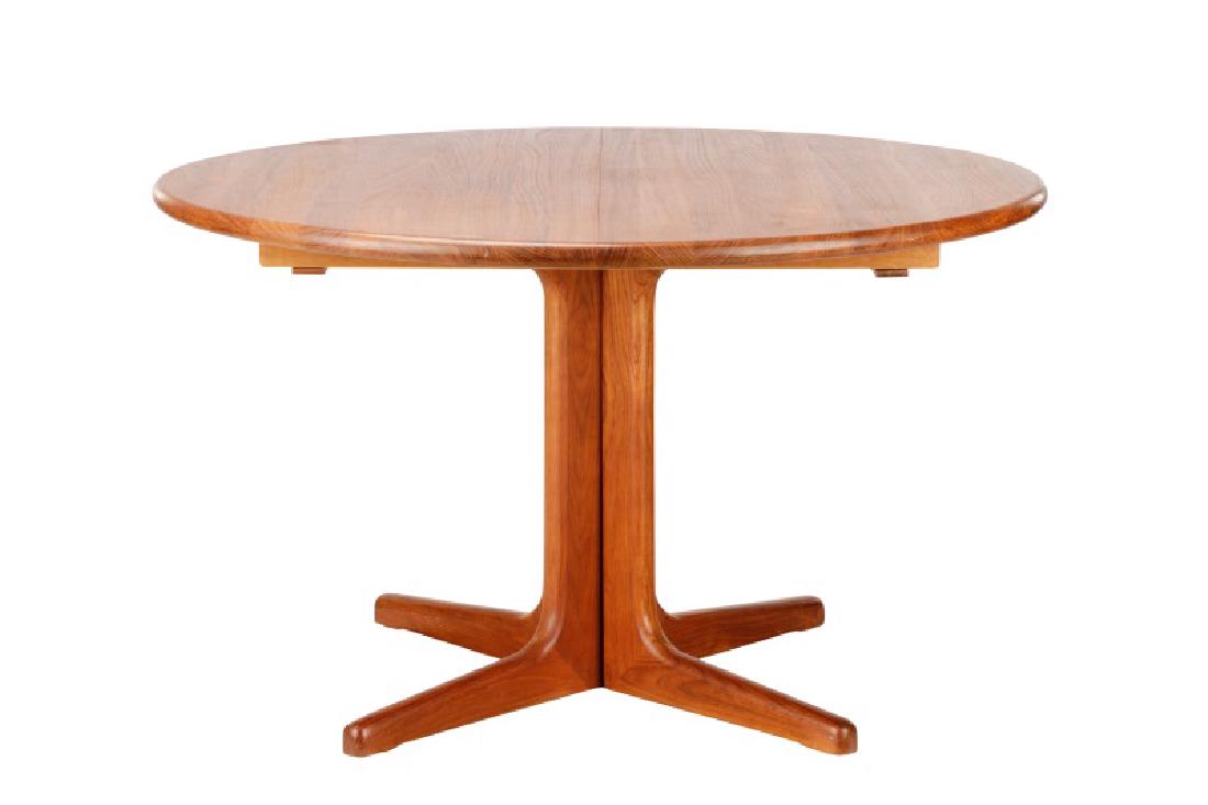 Moller Style Danish Modern Teak Dining Table: Style of Niels Moller (Danish, 1922-1988) for Gudme Mobelfabrik, 1960s. A round Danish mid century modern teak extension dining table, having a round top with a banded edge on a four-fluted pedestal b