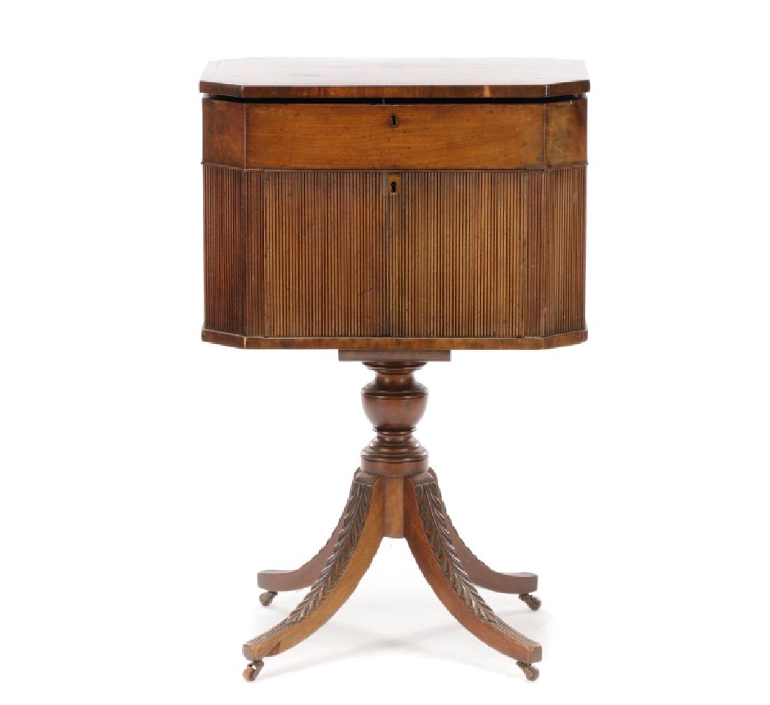 American Federal Work Table, Duncan Phyfe (attr): Attributed to the workshop of Duncan Phyfe (American, 1768-1854), early 19th century. A Federal mahogany work table having a rectangular hinged top with canted corners over a conforming case opening t