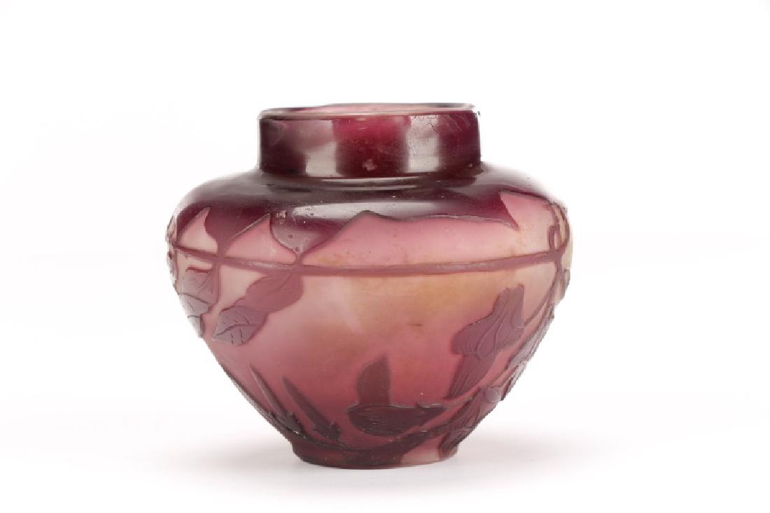 Diminutive Galle Cameo Glass Vase, Signed: Galle (French (Nancy), founded 1873), circa 1900s. A cameo glass vase of small squat form, the violet and opaque ground overlaid in purple leafy foliage. Signed "Galle" in cameo. Approximate height 2.