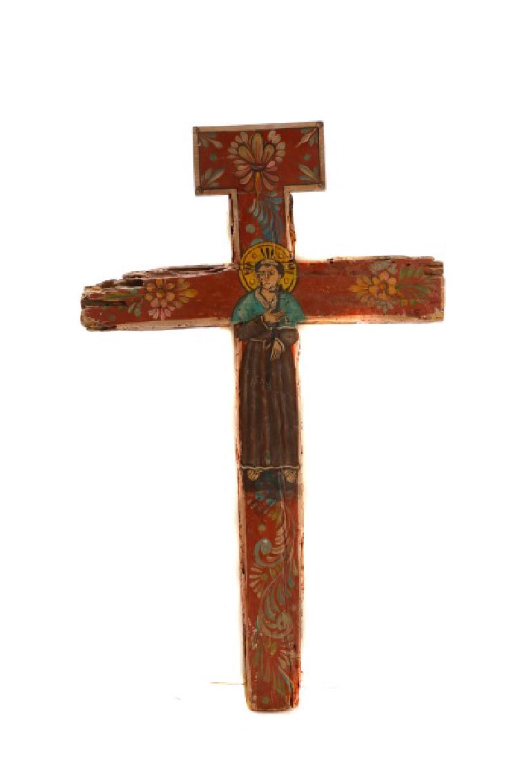 Polychromed Wood Santos Cross, Signed: Latin American School, Cross Santos, oil on found wood, signed TT Ramos F. Lemon. A polychromed cross made of found wood depicting St. Bartholomew, accounted with flowers. Approximate height 49", widt