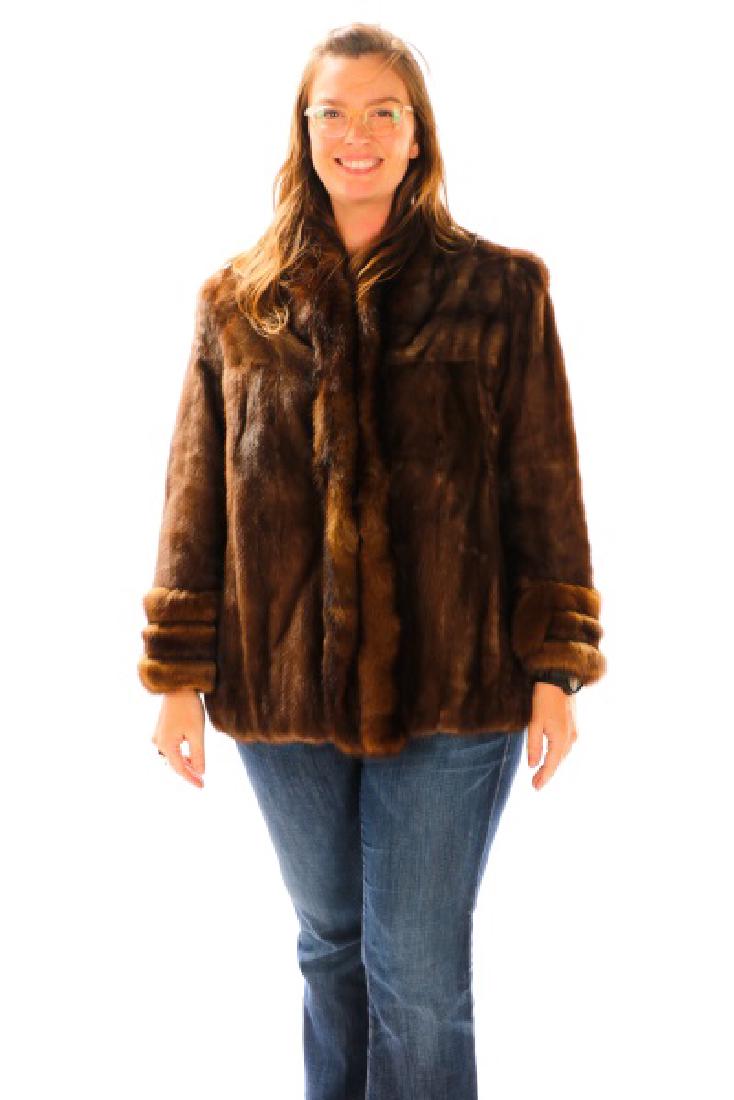 Ladies Hip Length Mink Coat: A ladies' hip length mahogany mink coat, having a collar, an applied collar, and cuffed sleeves. Lucci Furs Atlanta label to interior. Approximate width 20.5", length 29". Provenance: From the Private
