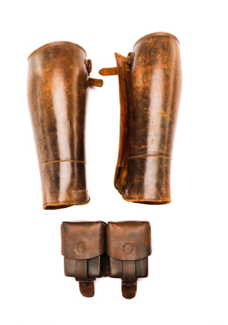 Pair, Leather Shin Gaiters & Ammo Pouch: A pair of leather shin guard gaiters along with a leather double ammunition pouch, likely WW1 era. Approximate height of shin gaiters 11.62". Approximate height of pouch 4", width 5.75", depth 2".