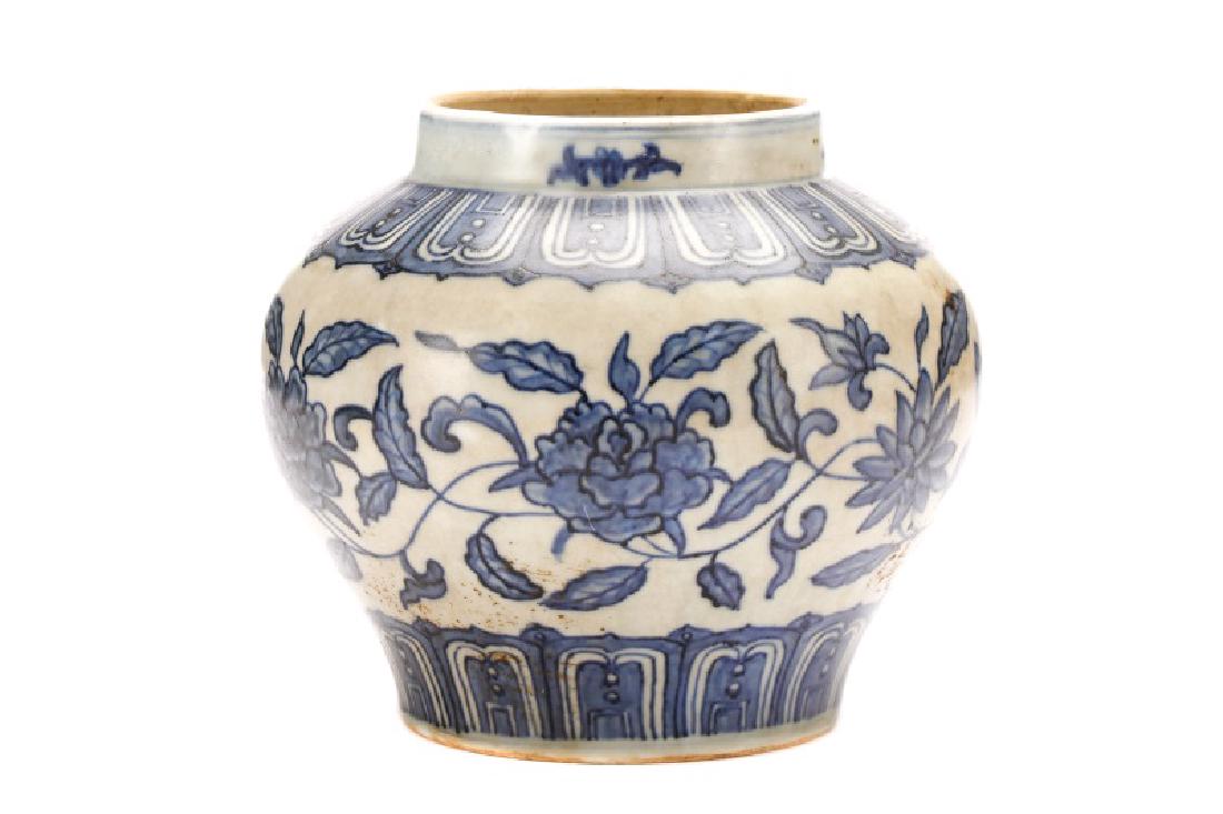 Chinese Ming Style Blue and White Jar: Chinese, 20th century,. Ming Dynasty style blue and white jar with floral sprays on neck above rounded bulbous body with lappet border at top and bottom flanking florals on white ground. Unmarked. Ove
