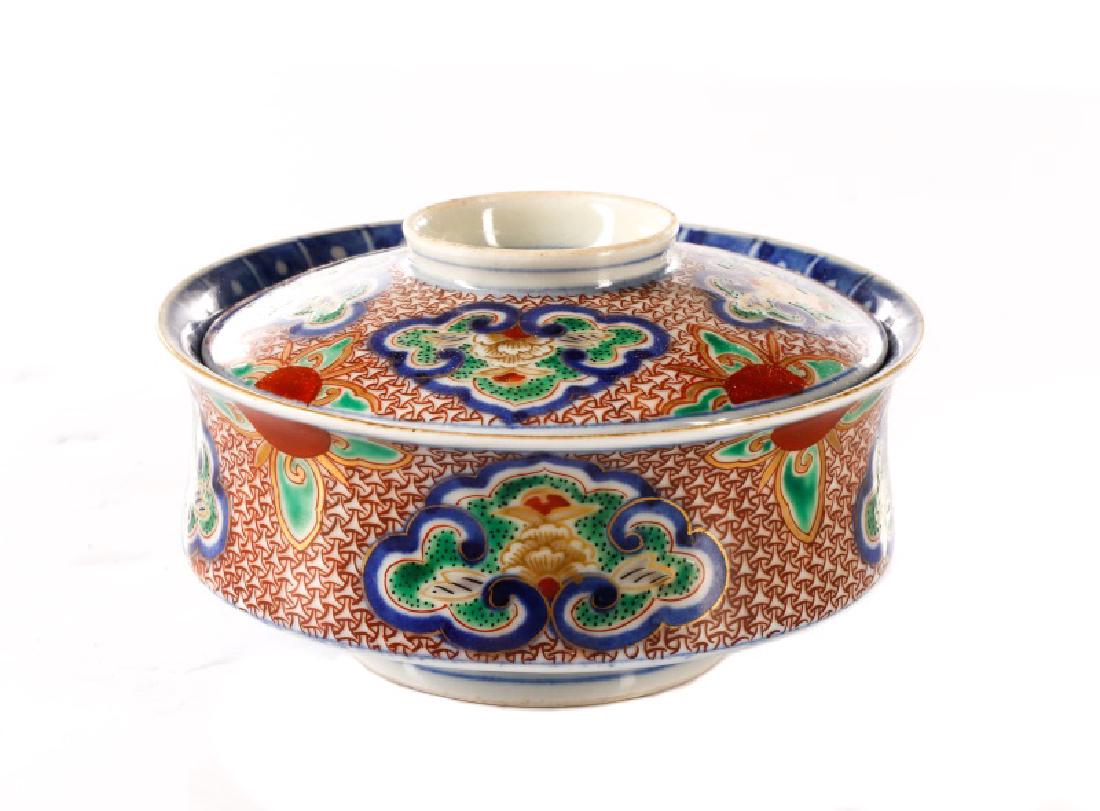 Very Fine Chinese Porcelain Lidded Rice Bowl: Chinese, Ming Dynasty Longqing Period mark (1567-72), likely later. A very fine hand painted porcelain covered rice bowl with exterior covered in hand painted sanguine patterning with clusters of coba