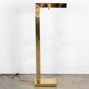 Modernist Brass Floor Lamp by Chapman, 1979: Chapman Manufacturing Company, circa 1979 Low-profile floor lamp reminiscent of the Paul Evans for Directional Cityscape series, with pivoting and tilting head for multi-directional use Lacquered bras