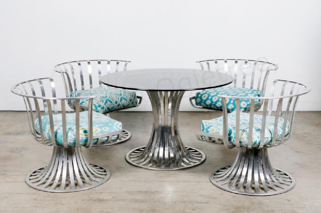 Russell Woodard 5-Piece Aluminum Dining Set, 1960s: Woodard Furniture Co., Russell Woodard, 1960's A five piece set of polished aluminum outdoor furniture including four tulip shaped swivel lounge chairs and table with aluminum body and smoked glass to
