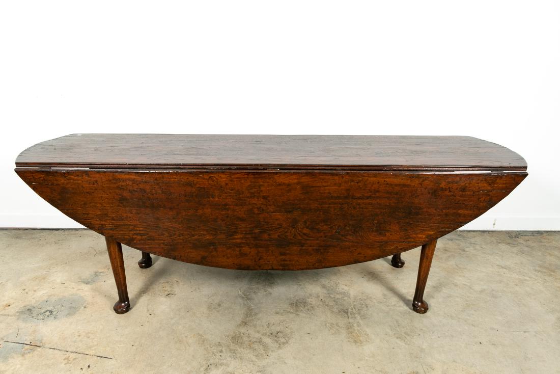 Large Queen Anne Style Oak Drop Leaf Table: American, 20th century A oak drop leaf Queen Anne style console or dining table Unmarked approx. h. 30.25", w. 90.25", d. 22" (closed), d. 60" (open)