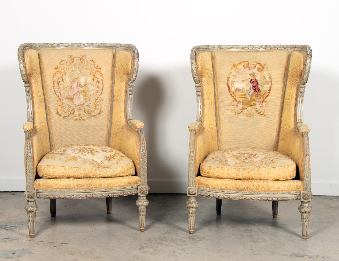 Pair, 19th C Louis XVI Bergeres avec Orielles: French, late 19th / early 20th century A pair of carved Louise XVI style needlepoint upholstered confessional Bergeres avec Orielles armchairs with figural motif Unmarked Approx. h. 44", w. 27.5", d. 
