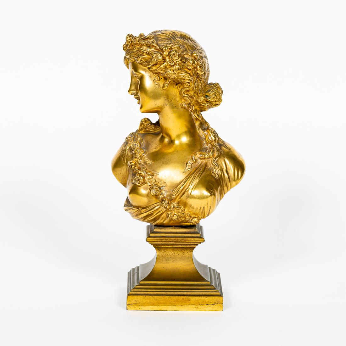 After Herni Picard, Bronze Grecian Female Bust: After Henri Picard (French, 1831-1864), first half 20th century A gilt bronze Grecian female bust with her head turned slightly to the right and having floral swags on her body and hair Marked on base