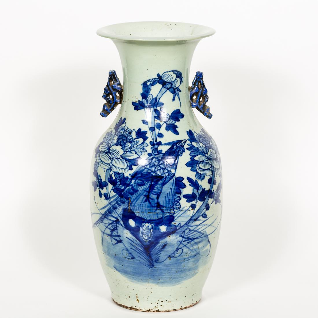 Blue and White Phoenix Porcelain Vase w/ Handles: Chinese A blue and white vase with shishi (fo dog) handles and phoenix surround by flowers Unmarked Approx. h. 16.875", w. 7" Provenance: From the Lifetime Collection of Dick and Betty Hoepfinger, of 