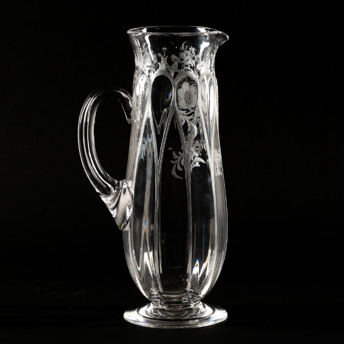 Art Nouveau Engraved Glass Pitcher: With floral engraving and tear drop decoration, in the style of Stevens and Williams. 11" h. Provenance: From the Lifetime Collection of Dick and Betty Hoepfinger, of Marietta, Georgia.