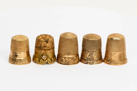 Group, Five Various Gold Thimbles: Five vintage gold thimbles of various sizes, makers and design, one with a small diamond. Four marked 14KT to the interior, the last hallmarked for Simon Brothers and "A". Approx. weight 18.8 grams. P