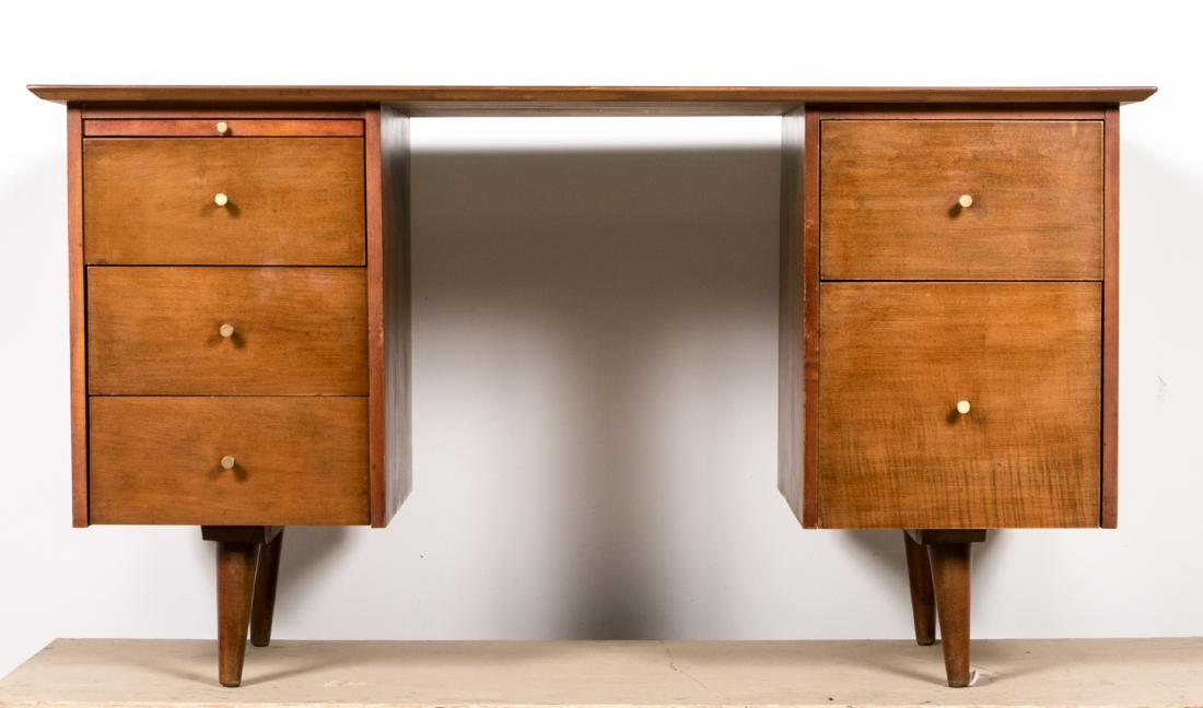 Paul McCobb Mid Century Double Pedestal Desk: Paul McCobb for Planner Group (American, 20th century) A mid century modern double pedestal desk with mahogany veneer and five drawers Paper label on interior of drawer Approx. h. 29", w. 53", d. 26.3