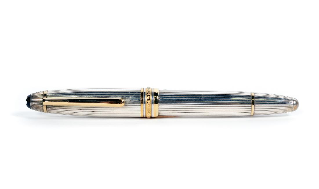 Montblanc Sterling Meisterstuck #146 Fountain Pen: Montblanc (German, founded 1906) Meisterstuck #146 fountain pen, circa 1990s, with striated sterling silver barrel and cap, gold accents, and 18k gold bi-color 4810 Montblanc nib Maker's marks to cap 