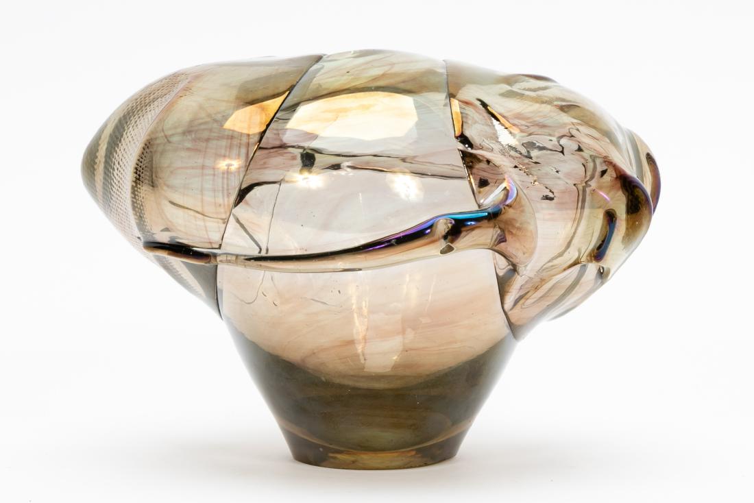 James Wayne Abstract Blown Glass Sculptural Vase: James Wayne (American, b. California), circa 1970s. A blown, molded and press-stamped glass vase or vessel having slight iridescence. Signed to the underside "Jim Wayne". Approx. height 4.75", width 7
