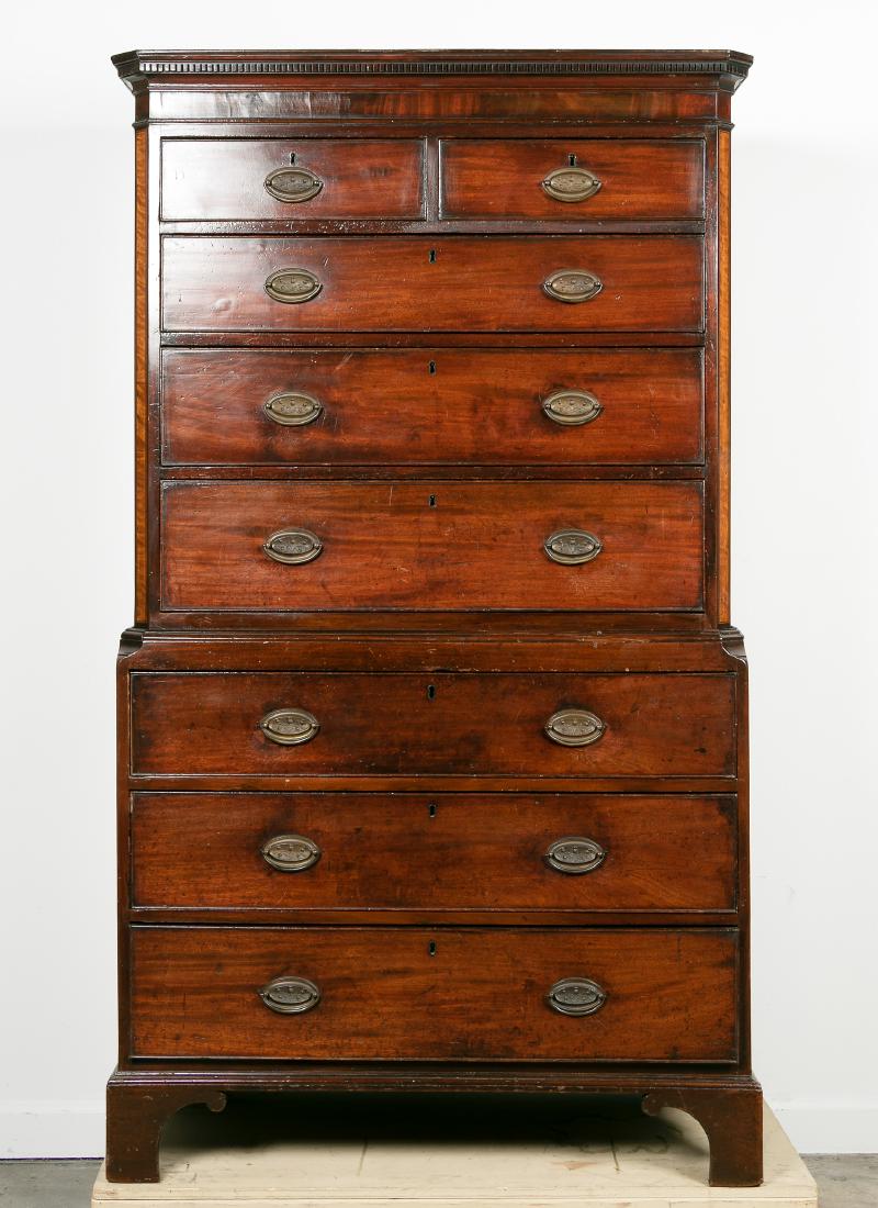 George III Mahogany Chest on Chest: English, late 18th / early 19th century. A George III mahogany chest on chest, cornice with dentil, double arched molding, upper section with fruit wood inlay, on serpentine bracket feet. Unmarked. Ap