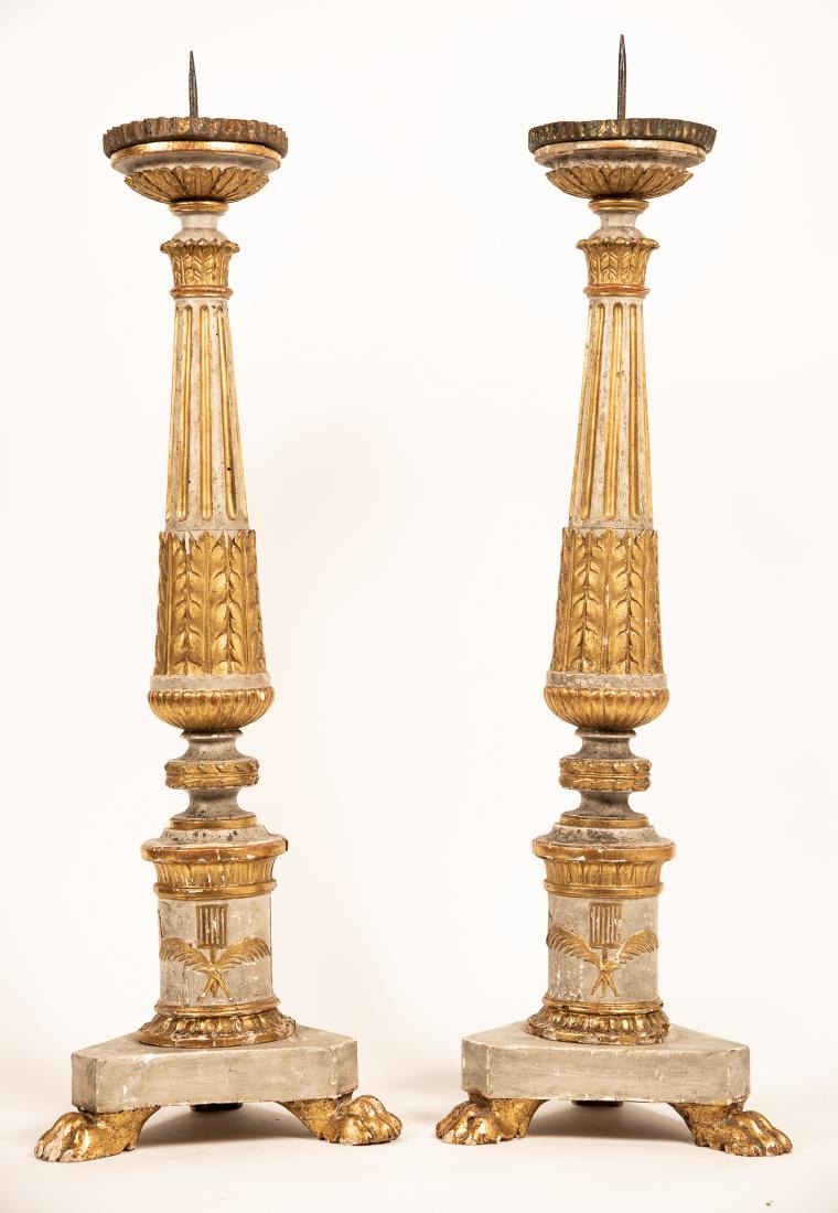 Pair, Patinated & Parcel Gilt Candle Prickets: Italian, 19th c. Pair of patinated and parcel gilt carved wood candle prickets or altar prickets with sharp metal pricket and leafy decoration on tripartite base with paw feet. Approx. height 32.12". 