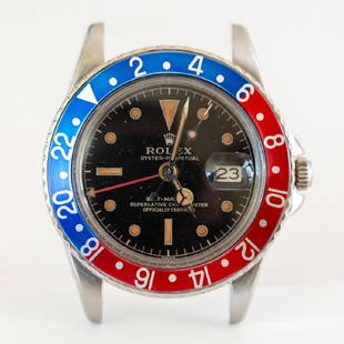 Vintage 1964 Rolex Stainless GMT Model 1675: Rolex. Stainless steel G.M.T. model 1675 wrist watch, circa 1964. Black face with gold markers, red and blue bezel. Serial # 104xxxx. Lacking band. 42.3mm with crown. Shipping Disclaimer: This is