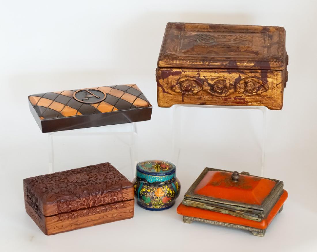 Group, Five Decorative Boxes: Group of five decorative boxes comprising a distressed gold and red covered box; wood carved reticulated box from India; polychrome paper mache box; metal box with 'A' monogram by Hyde Park and Morocc