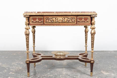 Louis XVI Style Red Marble Center Table: In the manner of Adam Weisweiler (German / French, active circa 1750-1810), French, 20th century. A Louis XVI style center table with red marble top, single drawer, bronze mounts, caryatid legs, and a