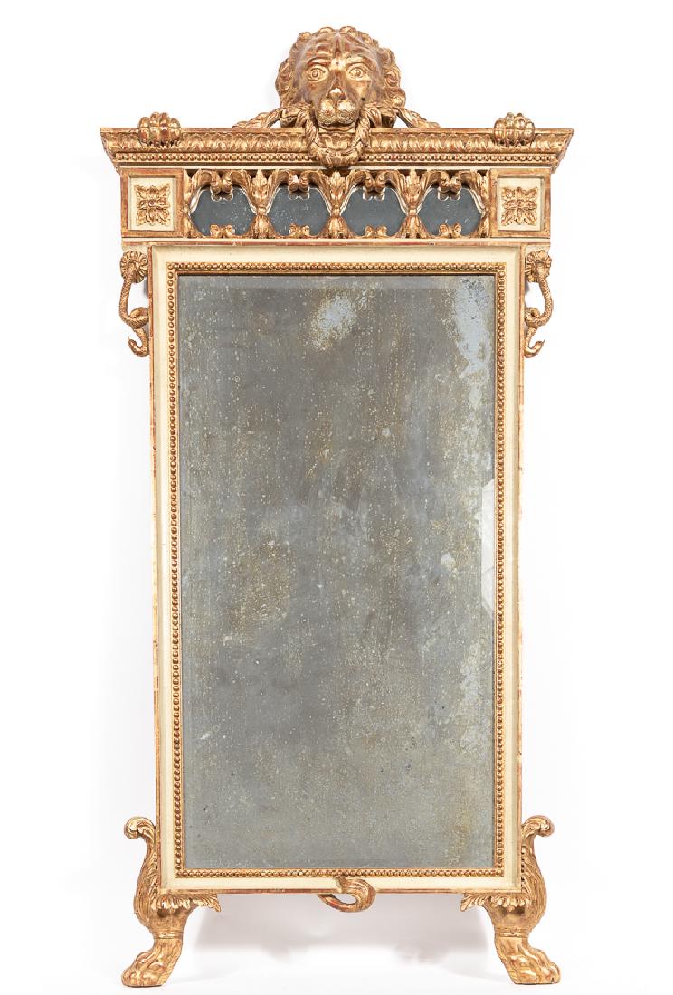 Italian Empire Style Giltwood Lion Head Mirror: Italian empire style giltwood lion head mirror. Wood, gesso and resin, lion's head a paws to the crest, raise-de-coeur and beaded cornice above a foliate carved frieze with rosette blocks, the distres