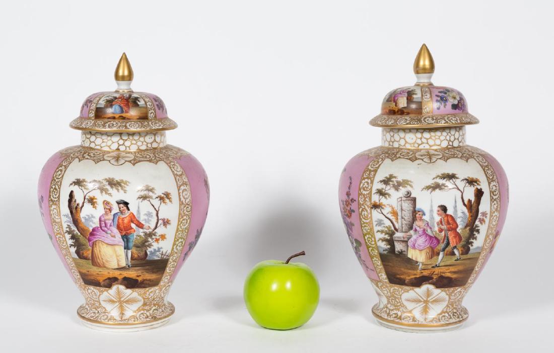 Pair, Helena Wolfsohn Dresden Lidded Urns: Late 18th century, Helena Wolfsohn (German, 1843-1949); polychrome had-paste porcelain with gilt accents; alternating panels of courting couples in 18th century dress and pink panels with florals. Mak