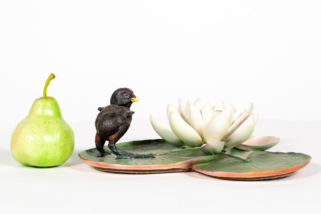 Dorothy Doughty Moorhen Chick & Water Lily: Dorothy Doughty (Italian, 1892-1962) for Royal Worcester (English, founded 1751). A bisque porcelain Moorhen Chick on a water lily. Marked on underside. Approx. h. 4.5". Provenance: From the Estate of