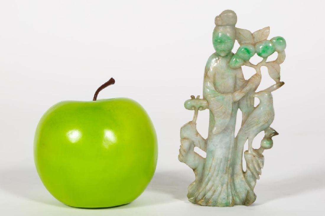 Chinese Carved Jade Quanyin Figure: 20th century, Chinese, carved 2-tone jade carving of Quanyin. Depicted standing and holding a prunus branch with fruit, a fenghuang bird at her side. 5.125" h., 2.625" w., .625" d. Provenance: From th