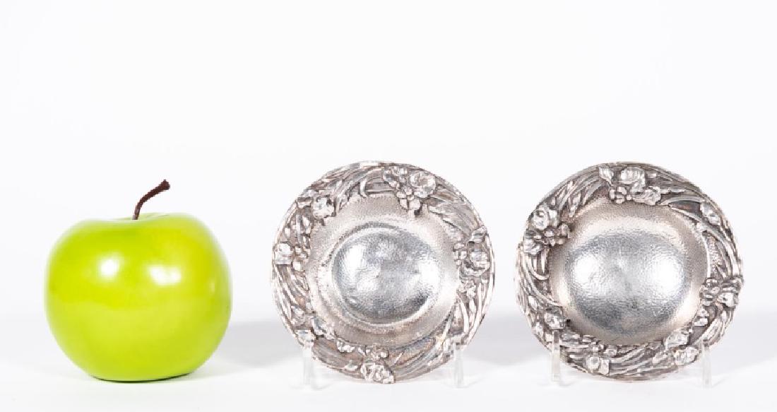 Pair, Japanese Meiji Era Silver Floral Dishes: Early 20th century late Meiji era, Japanese; art nouveau; circular sterling silver dishes with a raised iris and leaf pattern; footed. Finesse marks to underside. Approx. of one, h. 0.875", d. 4"; tot