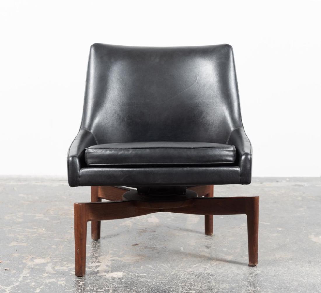 Jens Risom Black Swivel Chair, Spider Stretcher: Jens Risom (Danish, 1916 - 2016), circa 1960s. A mid-century modern black leather and mahogany swivel chair, with spider stretcher. Faded old tag under cushion. Approx. h. 30.375", w. 24", d. 19.5".