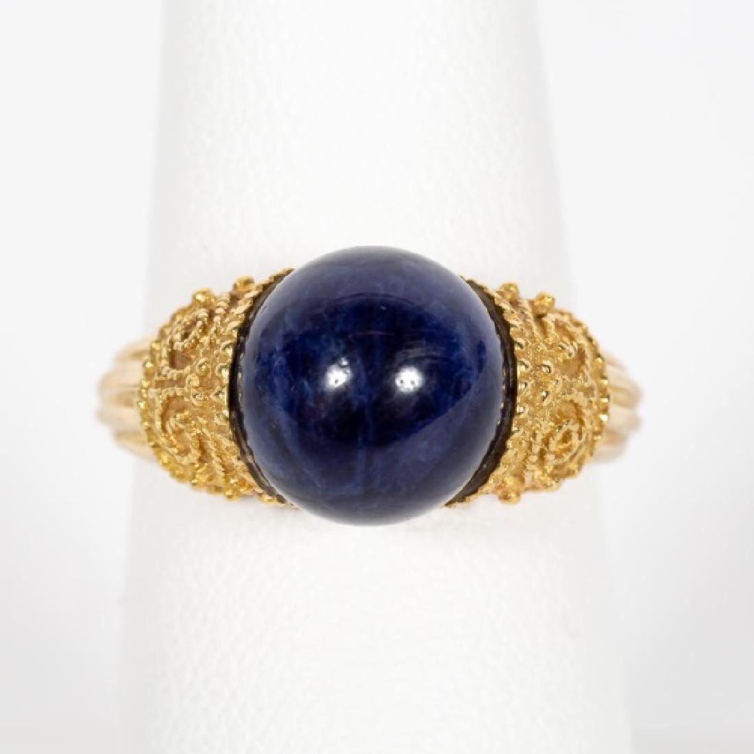 Etruscan Revival 18k Yellow Gold & Lapis Ring: An Etruscan revival style Lapis ring in 18 karat yellow gold. Marked on inside, 750, Greece, Makers mark, and 70. Approx. US. 7.5. Approx. total weight 7 g.